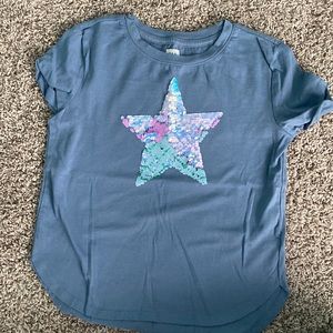 Never worn Gap T-shirt. Blue with sequin star. Size S.